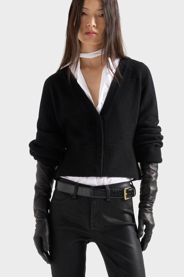 Model wearing a black cardigan from the latest Dispatch arrivals